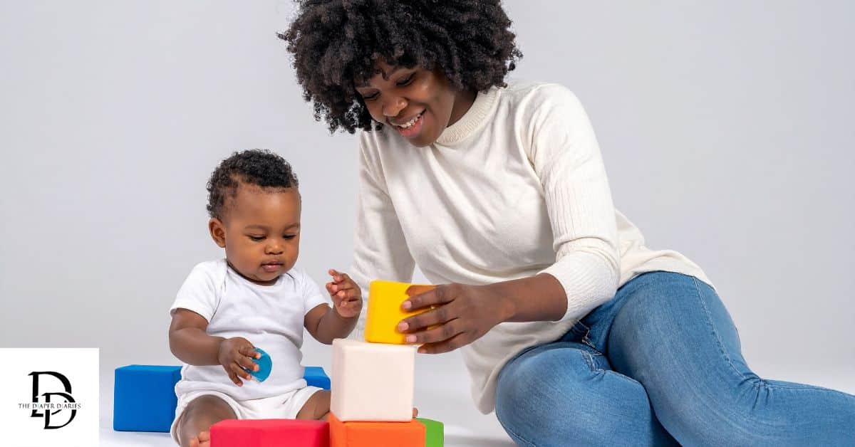 Toddler playing with toys on the floor, illustrating toddler essentials on a budget with simple, affordable playtime ideas.