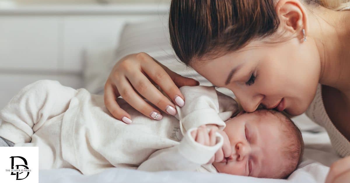 Loving mom leaning over and kissing her baby, representing saving money on baby essentials with coupons and free samples